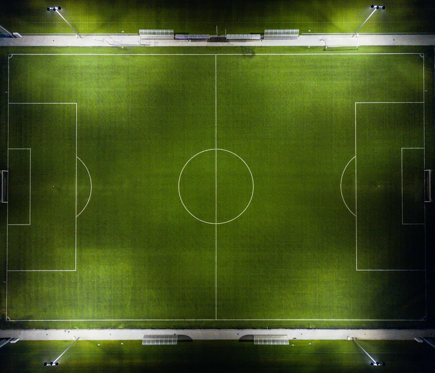 A floodlit football pitch seen from above